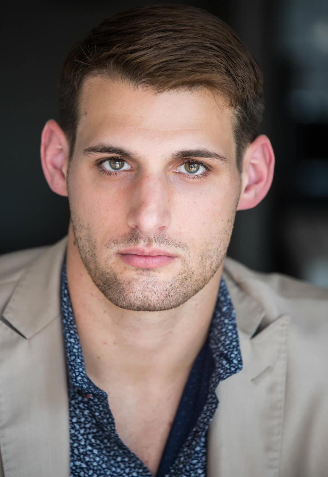 Devin Teer (@devinteerfilms) in a tan blazer